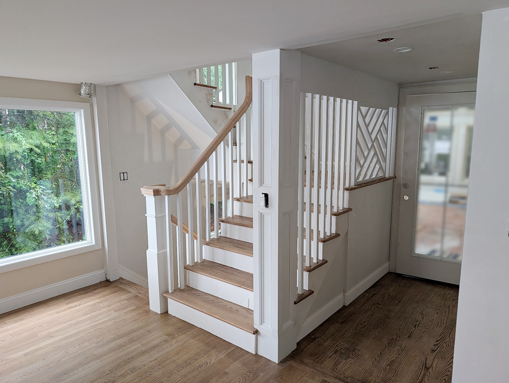 Staircase Build and Finish An elegant oak stairwary with curvy oak handrails and custom designed and built lattice panel that compliment the square blisters